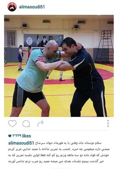 عکس کشتی گرفتن علی مشهدی با قهرمان جهان