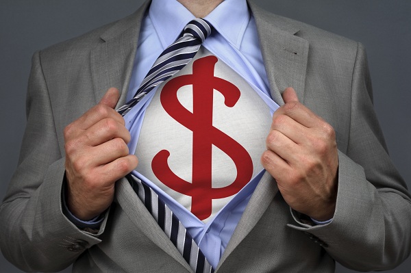 Businessman in classic superman pose tearing his shirt open to reveal a dollar symbol on chest concept for human financial advisor, success or recruitment