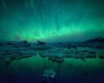 شفق قطبی بر فراز سرزمین یخی/عکس روز نشنال جئوگرافیک