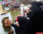 عکس/ نقاشی چهره شهدای مدافع حرم در راهپیمایی 22 بهمن